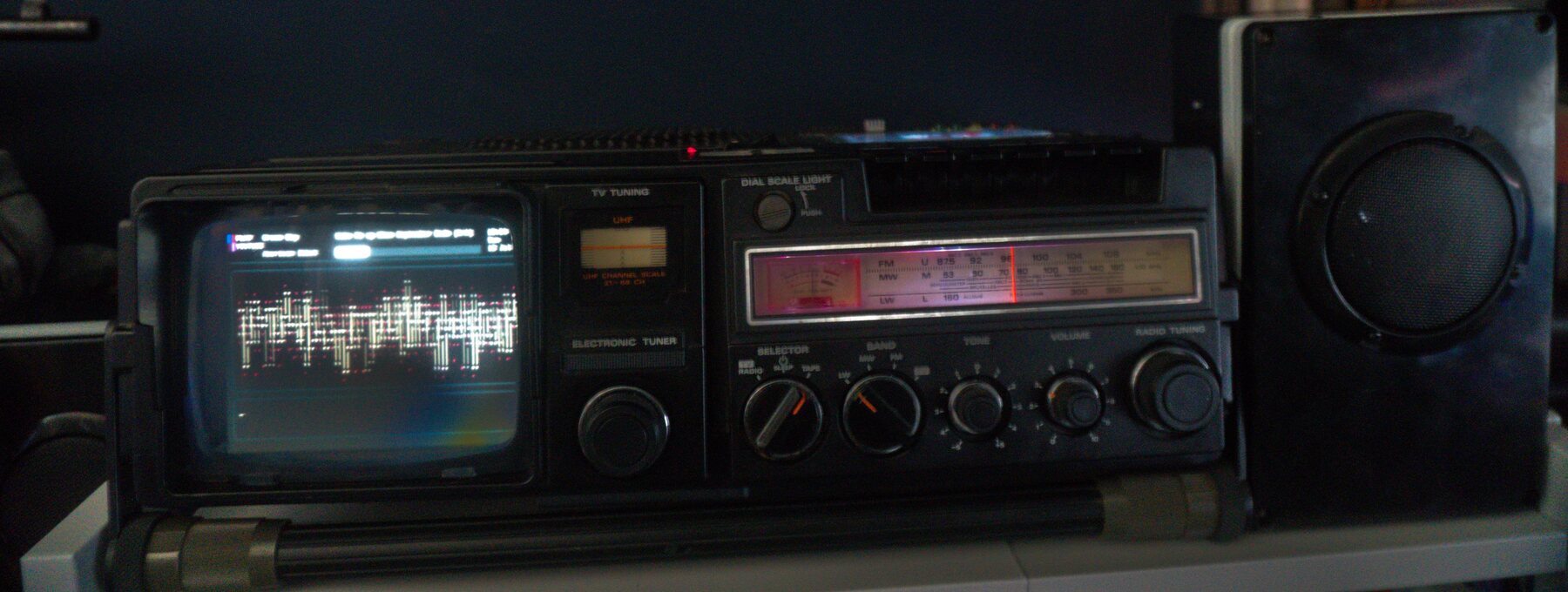 The restored Ember Deck Hitachi media console with waveform visualisation on its built-in display